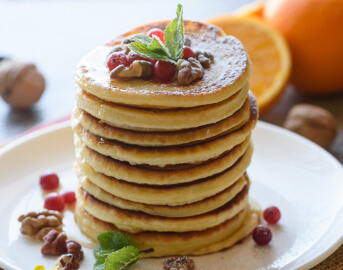 Stack of Fluffy Pancakes Topped with Berries Served at Senior Living Facility Stack of Fluffy Pancakes Topped with Berries Served at Senior Living Facility